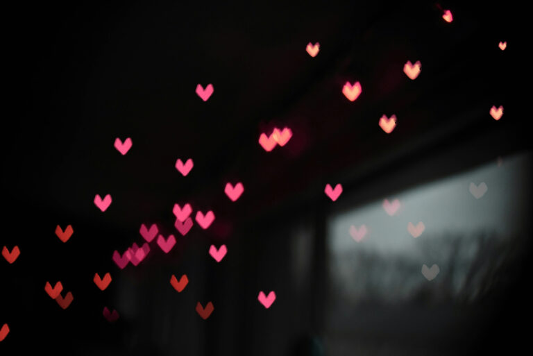 A room full of lights in the shape of a heart. And a window with some light streaming through.